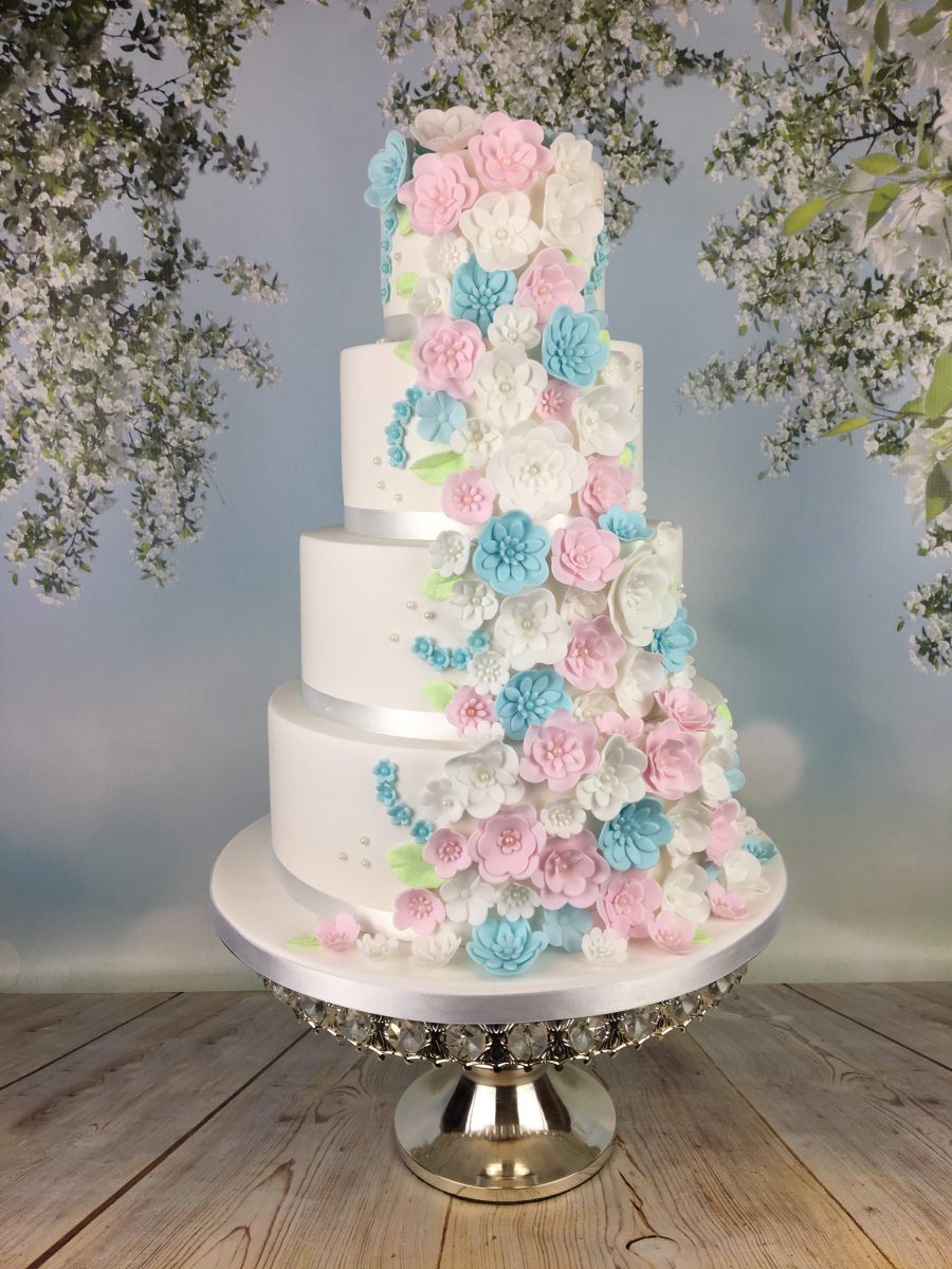 Pastel blue and pink blossoms wedding cake Mel's Amazing